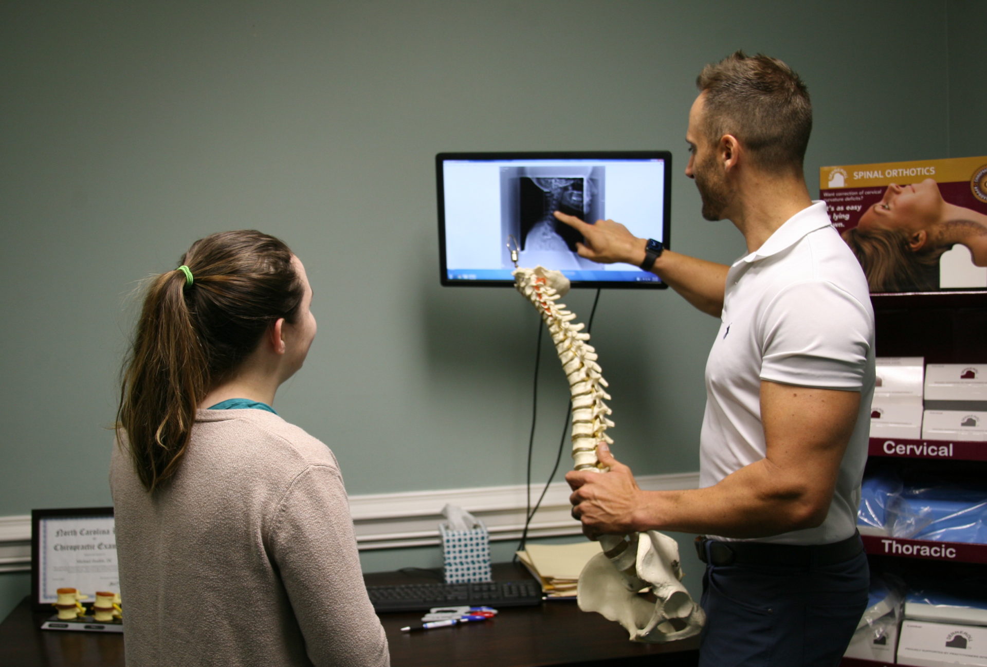 Raleigh Chiropractic and Wellness Chiropractor explaining the xray result